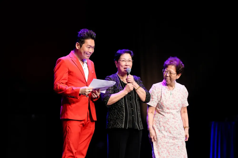James Yang presenting on stage at NUHS Superstar Nurses, 2024